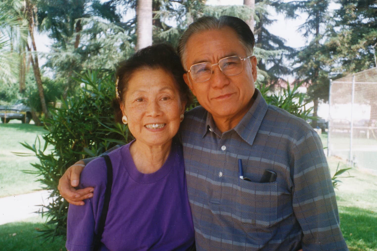Papa and Mama Chang, the program's founders, together outdoors.