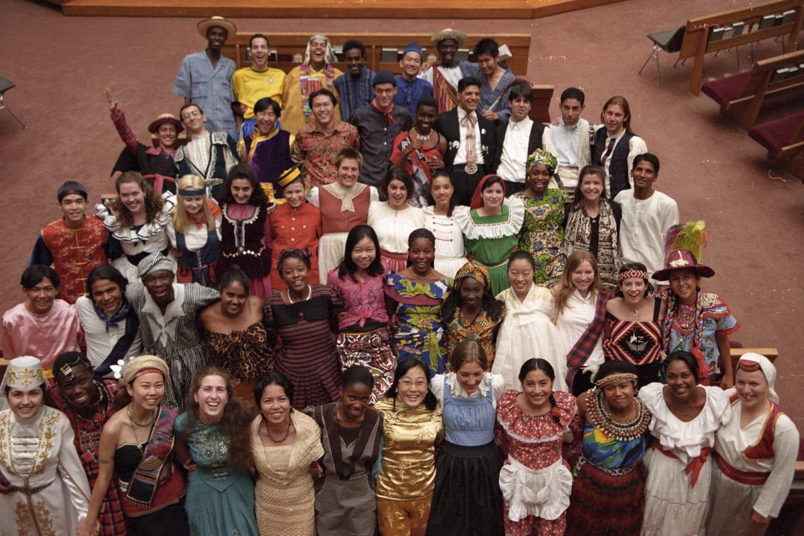 A year of the international youth choir — dozens of young people from around the world in traditional dress.